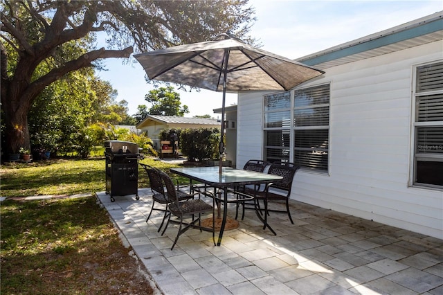 view of patio featuring a grill