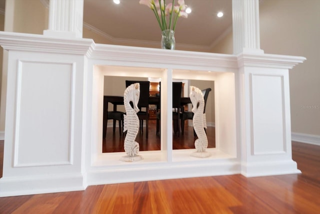 interior details featuring dark wood-type flooring and ornamental molding