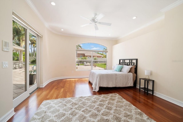 bedroom with access to outside, multiple windows, and dark wood-type flooring