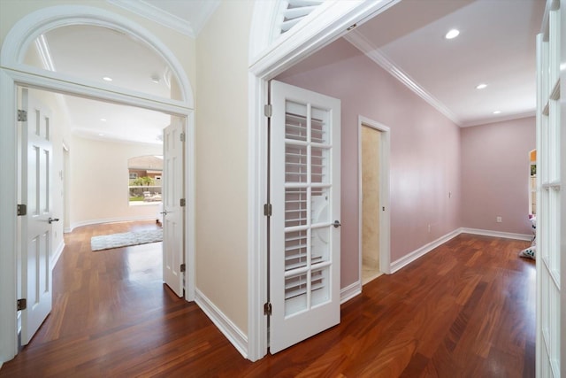 hall with ornamental molding and dark hardwood / wood-style floors