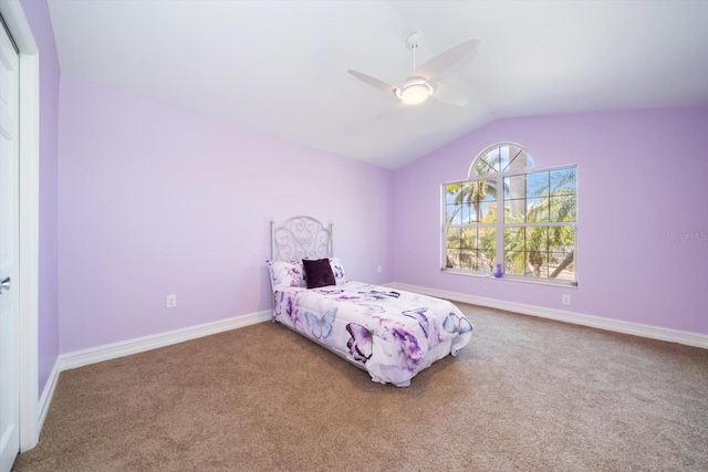 carpeted bedroom with lofted ceiling and ceiling fan