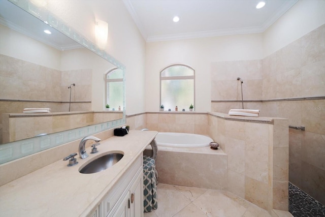 bathroom with independent shower and bath, tile floors, oversized vanity, and crown molding