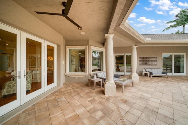 view of patio featuring french doors, an outdoor living space, and ceiling fan