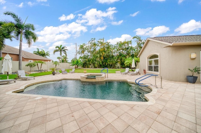 view of pool featuring a patio area and an in ground hot tub