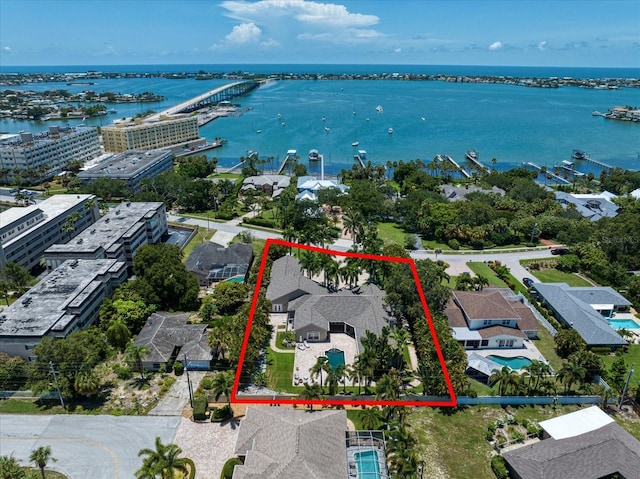 birds eye view of property with a water view