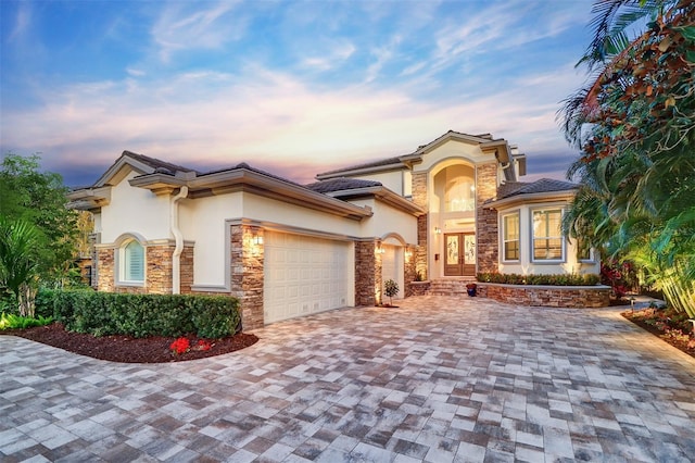 mediterranean / spanish-style home featuring a garage