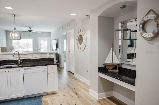 kitchen with white cabinets, dishwasher, hanging light fixtures, and sink