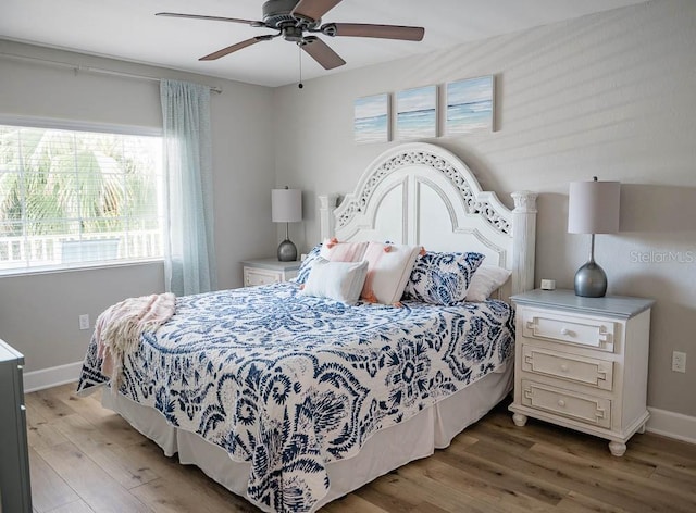 bedroom featuring ceiling fan and light hardwood / wood-style flooring