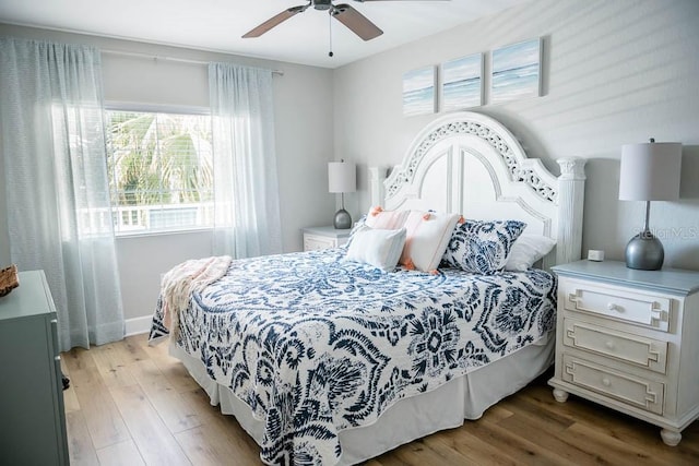 bedroom with wood-type flooring and ceiling fan