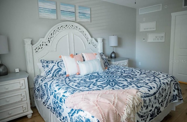 bedroom featuring wood-type flooring