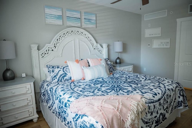 bedroom with hardwood / wood-style floors and ceiling fan