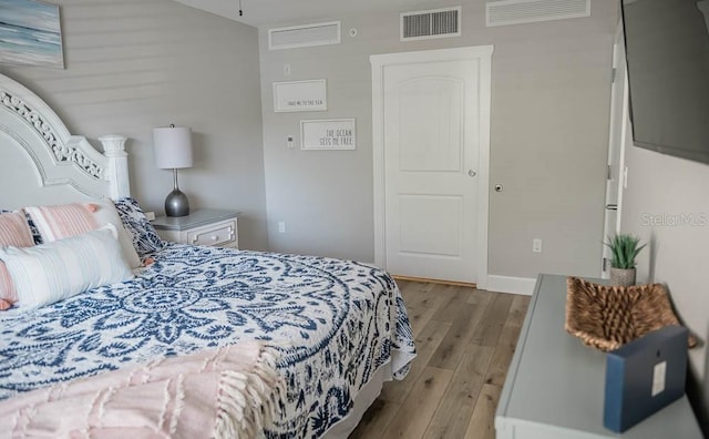 bedroom with light wood-type flooring