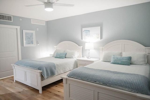 bedroom featuring ceiling fan and light hardwood / wood-style flooring