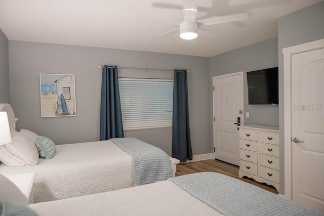 bedroom featuring ceiling fan and light hardwood / wood-style flooring