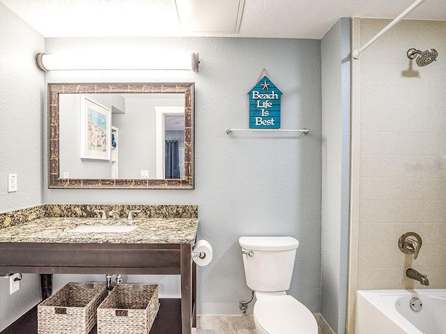 full bathroom with vanity, toilet, and tiled shower / bath