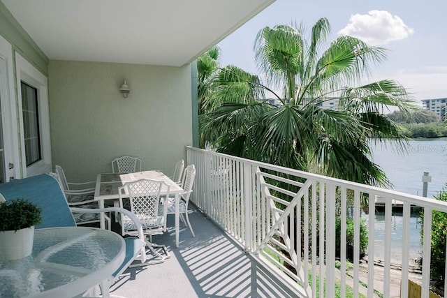 balcony featuring a water view