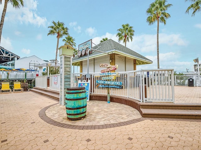 view of play area with a deck and a patio