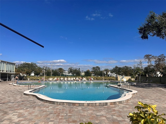 view of swimming pool featuring a patio area