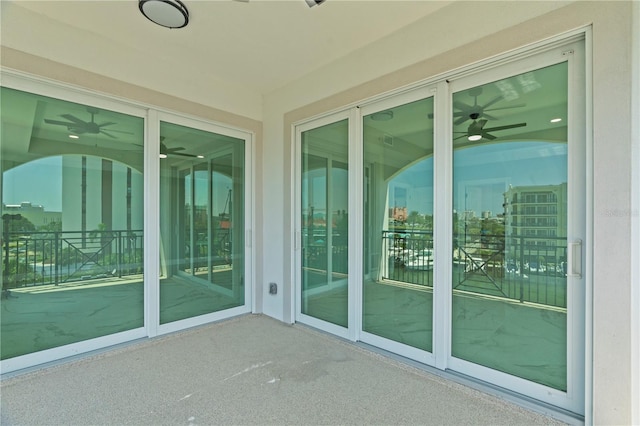 exterior space featuring ceiling fan