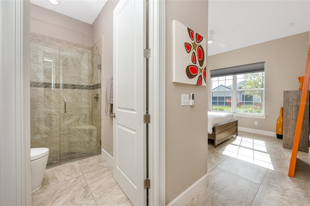 bathroom with toilet, tile patterned flooring, and a shower with door