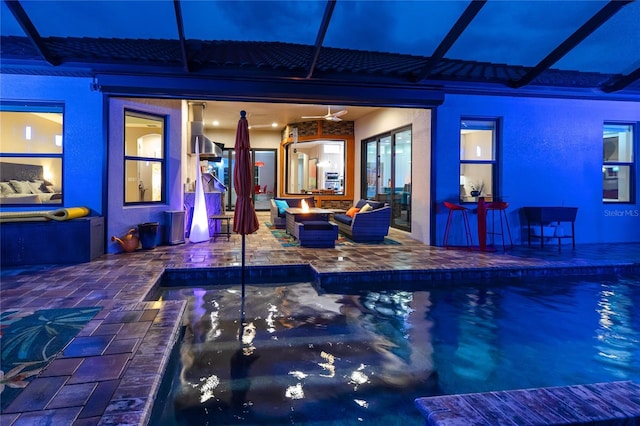 view of pool with a hot tub