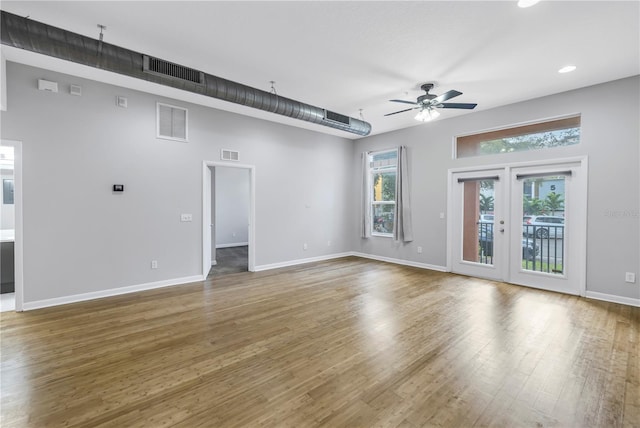 empty room with ceiling fan and dark hardwood / wood-style floors