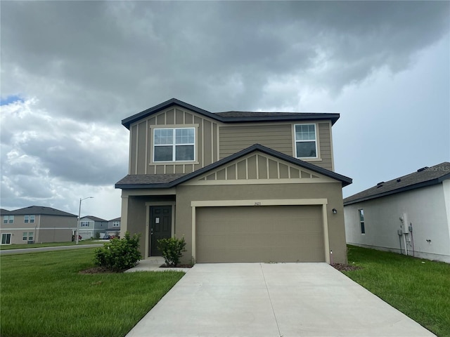 view of front of property with a garage and a front yard