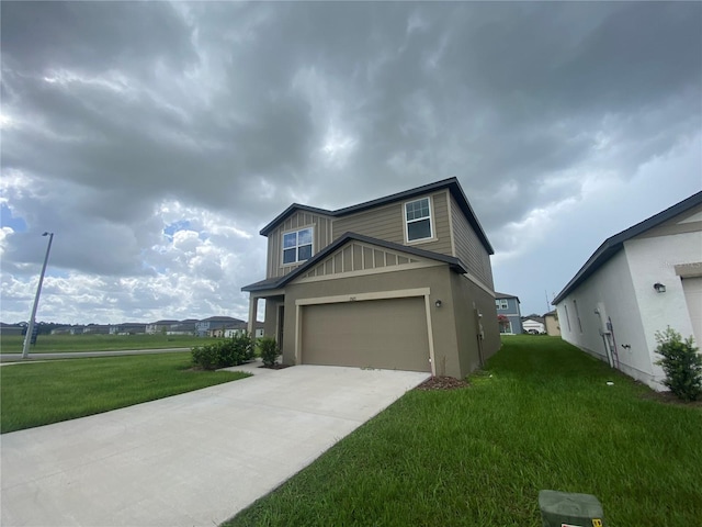 view of front of house featuring a front yard and a garage