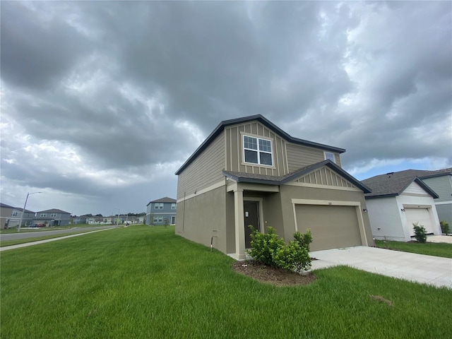 view of front of home featuring a front lawn and a garage