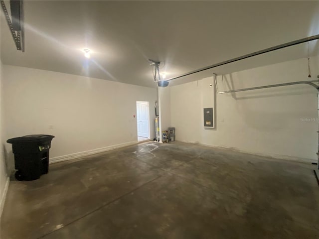 garage featuring a garage door opener, electric water heater, and electric panel