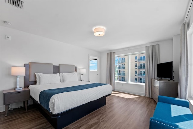 bedroom with wood-type flooring