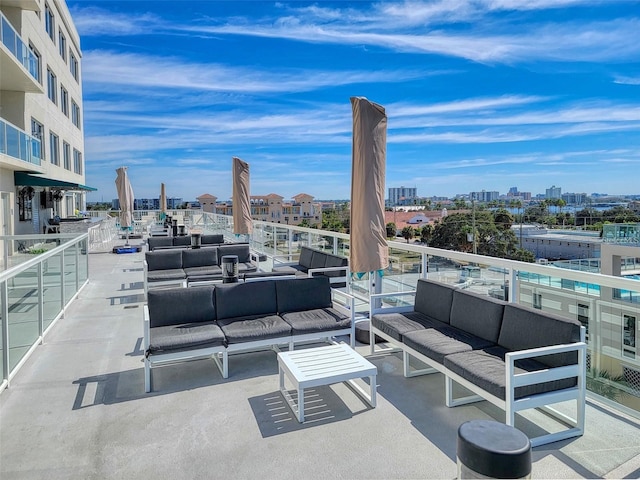 view of patio / terrace with a balcony and an outdoor living space