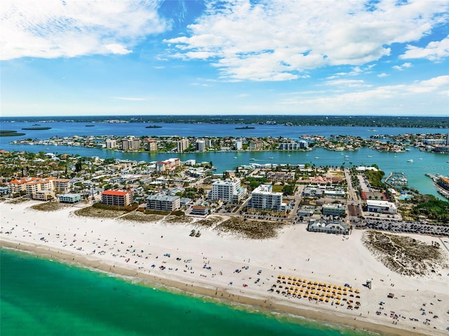 bird's eye view featuring a water view and a beach view