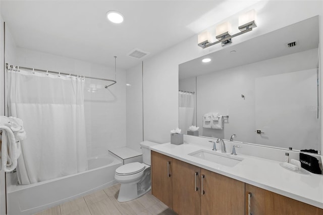 full bathroom featuring shower / bathtub combination with curtain, vanity, tile patterned floors, and toilet