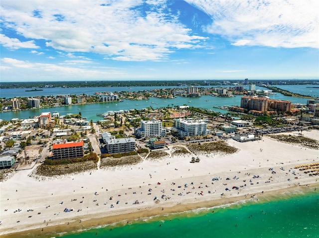 birds eye view of property featuring a water view and a beach view