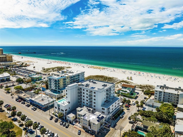 aerial view with a water view and a beach view