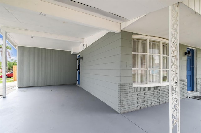 view of home's exterior featuring a carport