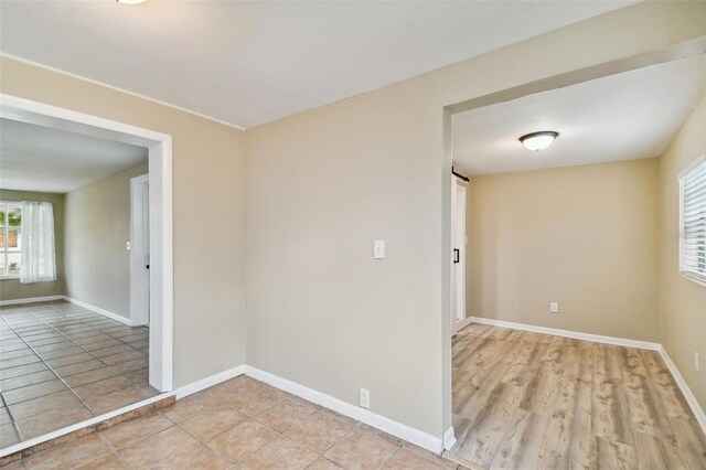 unfurnished room featuring light wood-type flooring