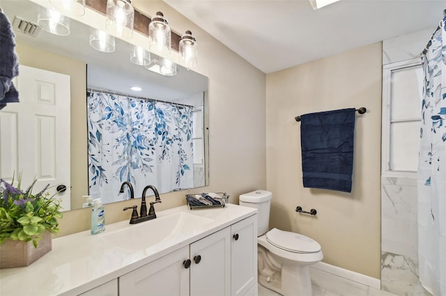 bathroom with curtained shower, vanity, and toilet