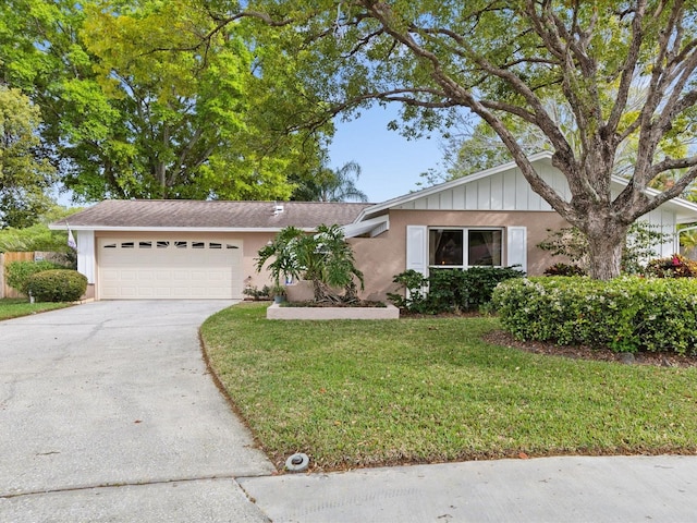 single story home featuring a front yard and a garage