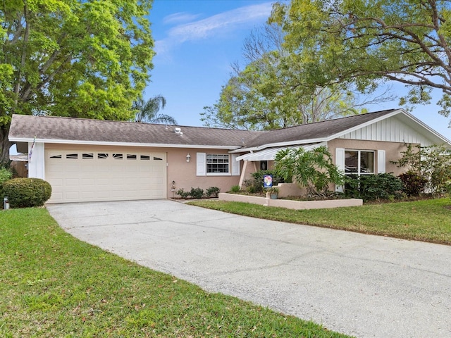 ranch-style home with a front lawn and a garage