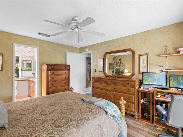 bedroom with connected bathroom, ceiling fan, and light wood-type flooring