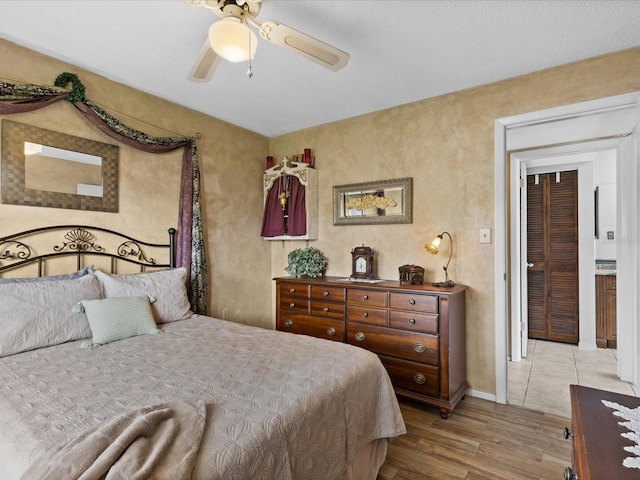 bedroom featuring ceiling fan and light wood-type flooring