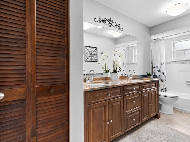 full bathroom with toilet, shower / bath combination with curtain, tile floors, dual vanity, and a textured ceiling