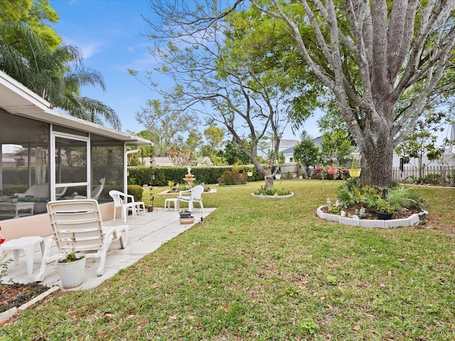 view of yard featuring a patio area and a sunroom