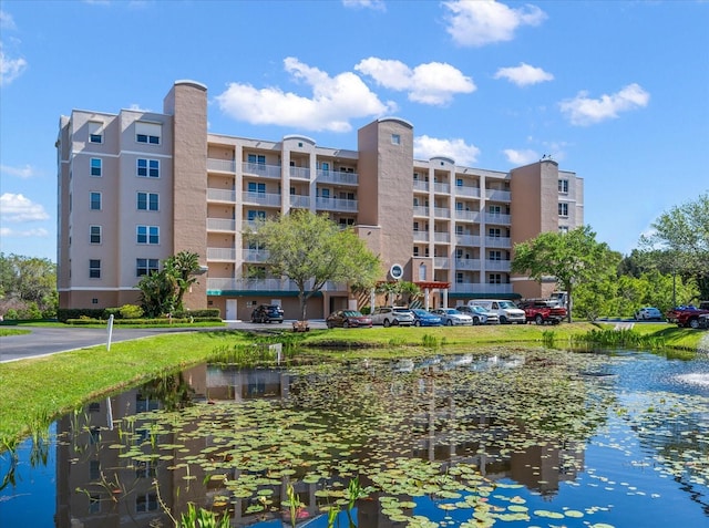 view of building exterior with a water view