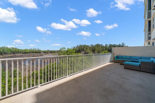 view of patio / terrace featuring a balcony and an outdoor living space