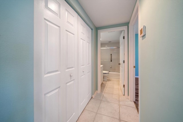 hallway featuring light tile floors