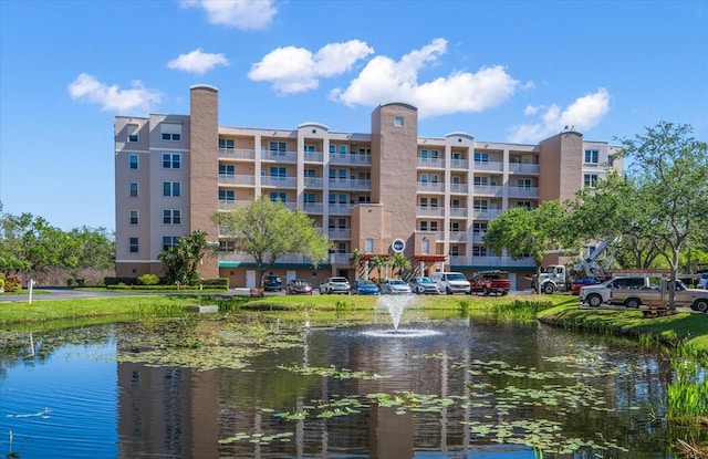 view of building exterior with a water view