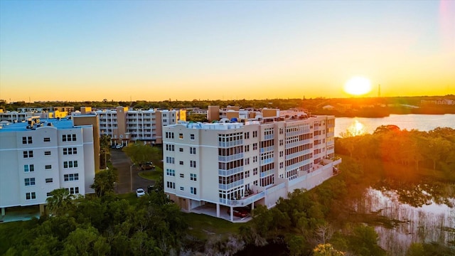 aerial view at dusk with a water view